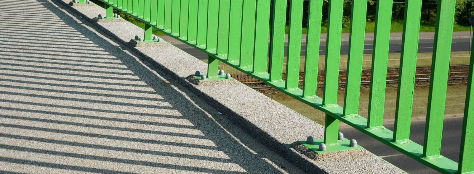closeup-base-green-barrier-overpass-bridge_181624-22816
