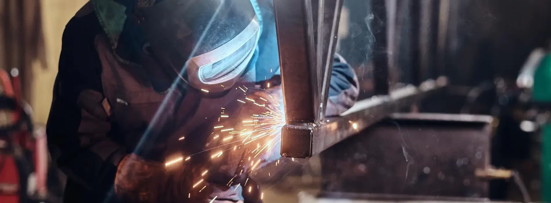 man-is-working-metal-factory-he-is-welding-piece-rail-using-special-tools_613910-3861.jpg